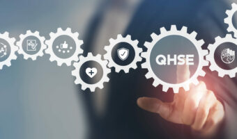 QHSE-Quality Health Safety Environment. Safety and health at workplace concept. Maximize value by successfully implementing QHSE management system. Businessman touching on QHSE and smart background.