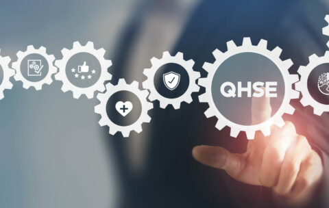 QHSE-Quality Health Safety Environment. Safety and health at workplace concept. Maximize value by successfully implementing QHSE management system. Businessman touching on QHSE and smart background.